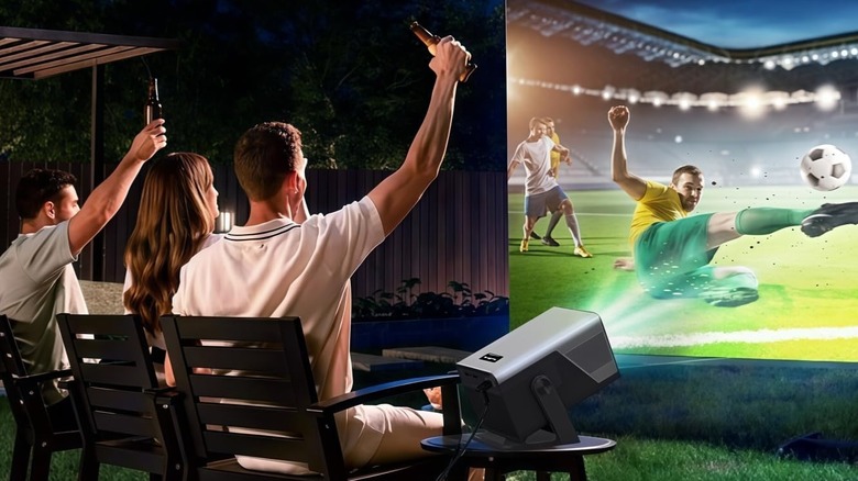 Friends watching soccer on the X7 2000 ANSI Smart Projector in the backyard.