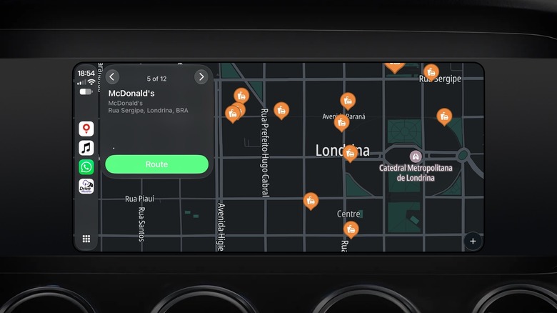 The TomTom app on CarPlay, showing the nearest fast food spots in a city.