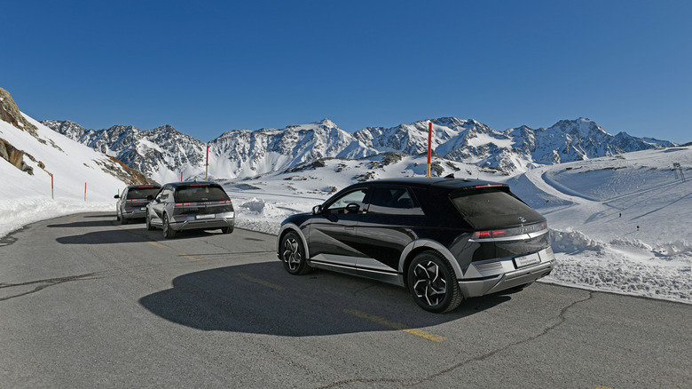 Several Hyundai Ioniq 5 models driving in cold weather conditions.