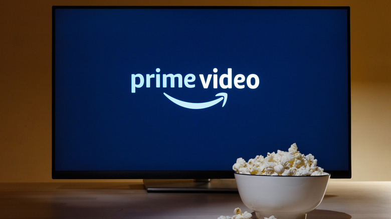 Prime Video logo on a TV, with a bowl of popcorn in front of it