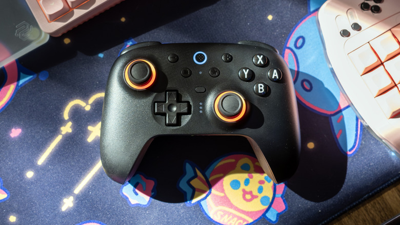8BitDo Ultimate 2 controller on a desk.