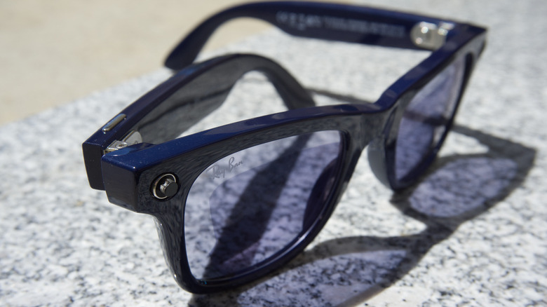 A pair of Ray-Ban Meta glasses with a cover on the LED.
