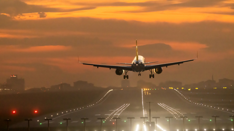 A passenger plane landing at an airport.