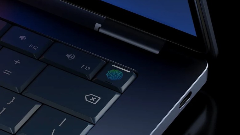 Corner of a laptop keyboard with a fingerprint design on one key.