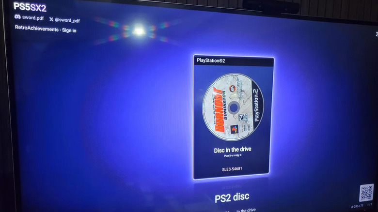 A TV screen showing the UI for the PS5SX2 homebrew software on a PS5. The PS2 disc Burnout Dominator is showing in the OS.