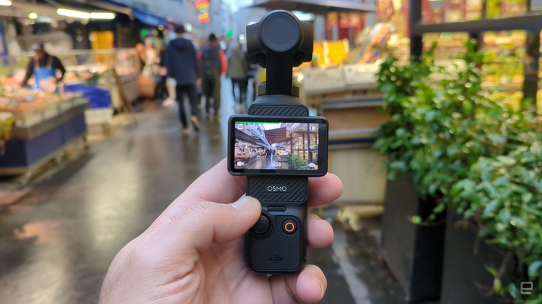 DJI's Pocket 3 gimbal camera is shown in a Paris market.