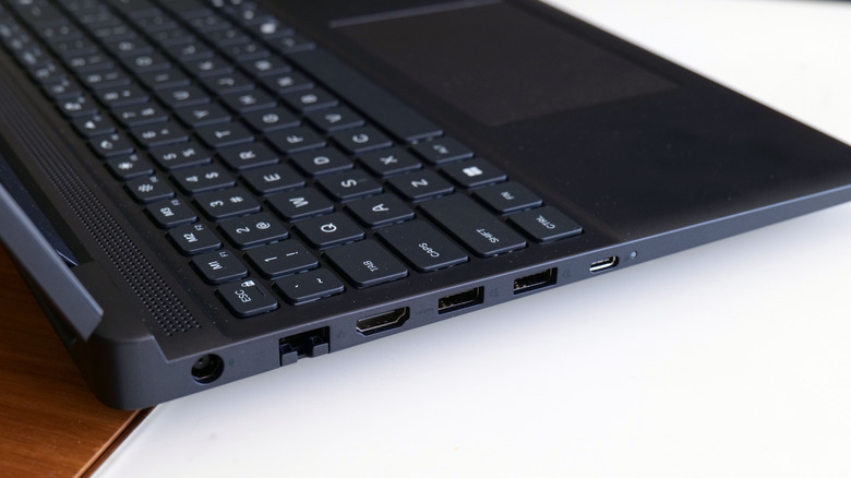 Ports on the left side of the Alienware 15 include HDMI 2.1, multiple USB jacks, Ethernet and more.