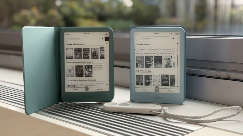 A Kindle and Kindle Paperwhite next to a remote for turning pages.