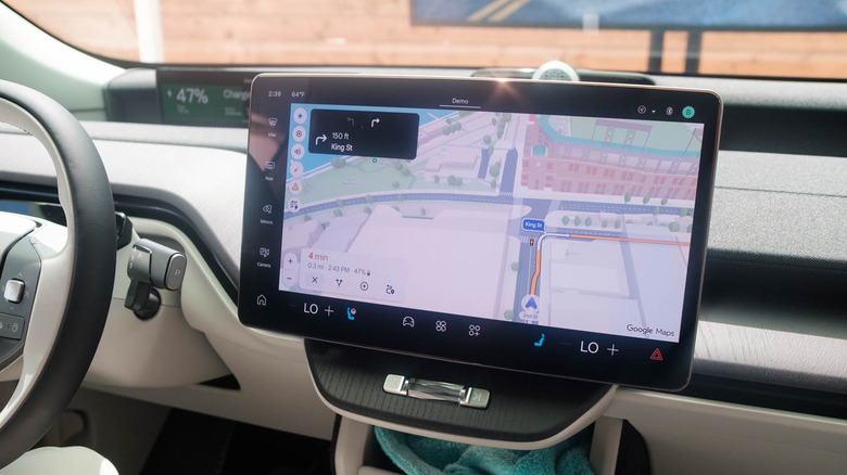 The infotainment screen in a Volvo EX60 displays Google's new Immersive Navigation feature.