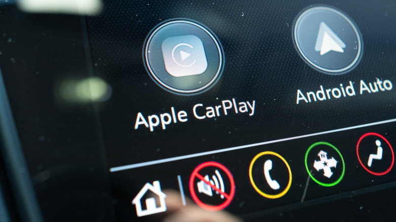 Apple CarPlay and Android Auto logos on a car's infotainment display