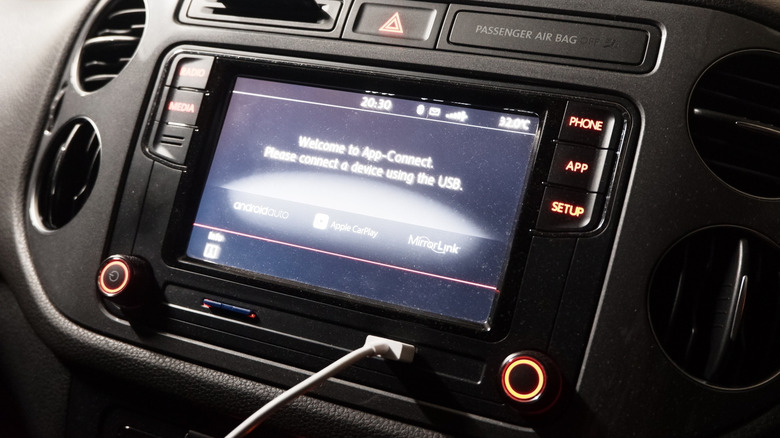 A car's infotainment system ready to connect to a phone using a USB cable
