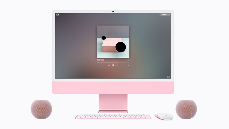 A pair of pink HomePod mini 2 paired with a matching pink iMac.