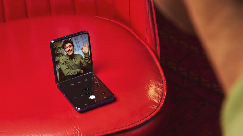 A 2026 Moto Razr Ultra taking a photo in a half-folded mode.