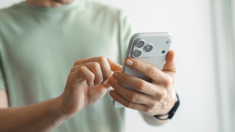 A person holding an iPhone