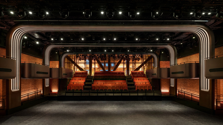 Apple Music Hall in London is shown from the stage point of view toward the seats and crowd floor