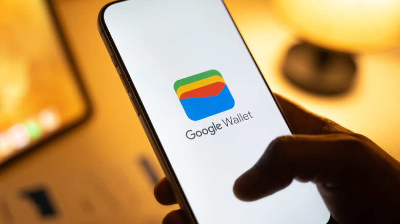 The Google Wallet logo displayed on a smartphone.