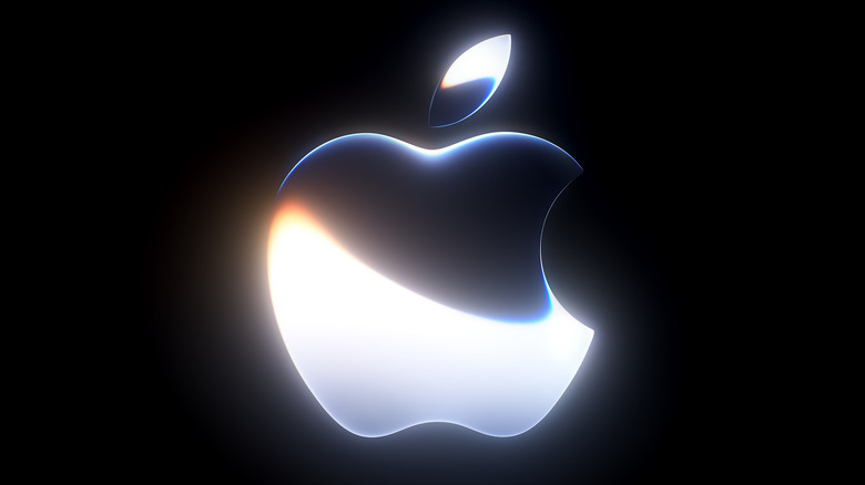 Against a black background is the Apple logo with a chrome effect gradient on its surface.