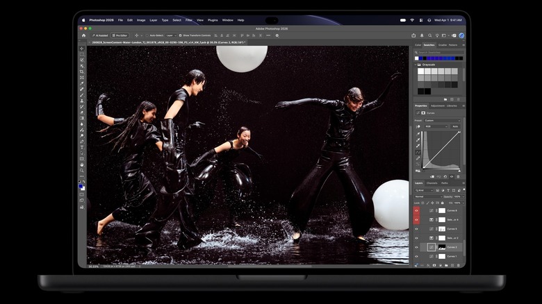 Apple's new touchscreen OLED MacBook Pro is shown with dancer imagery in dark costumes