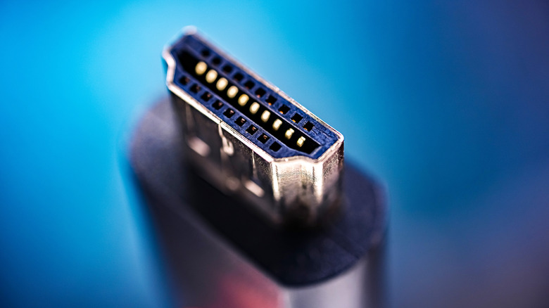 Close-up of an HDMI cable connector, showing its metal housing and internal contact pins.
