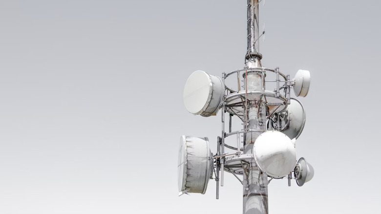 A mobile tower against a gray sky.