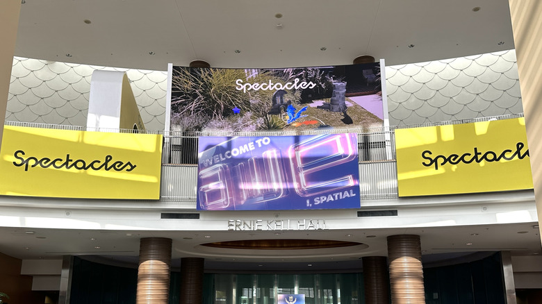 Three banners for Snap Spectacles around a sign saying 