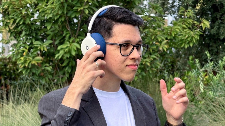Rocking the new Beats 360 headphones in white and blue.