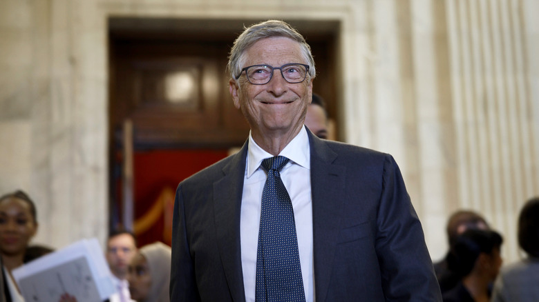 Bill Gates leaving an AI discussion in Washington.