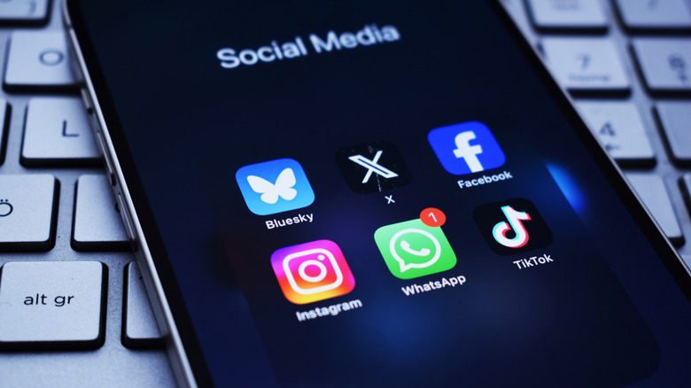 A phone showing social media apps