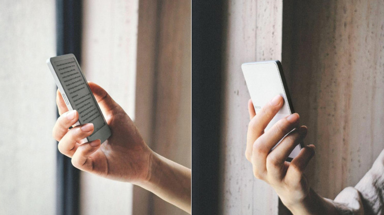 A hand holding an ereader from both sides.