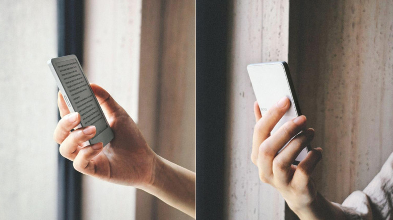 A hand holding an ereader from both sides.
