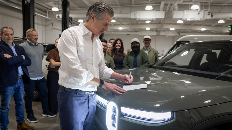California Governor Gavin Newsom signs bill providing up to $3,500 instant rebate for first-time EV buyers.