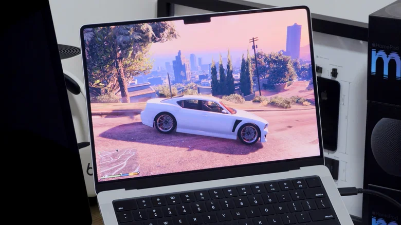 Playing GTA V on a MacBook Pro with a cable plugged into the USB-C port.