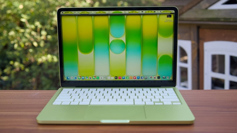 Straight-on photo of the MacBook Neo on an outdoor table