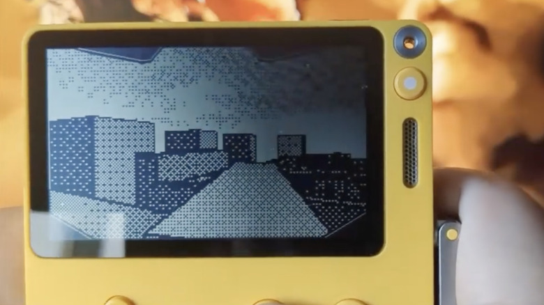 Screencap of a yellow Playdate gaming platform with a 3D rooftop shown on the screen.