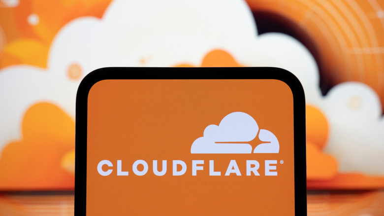 The Cloudflare logo displayed on a smartphone.