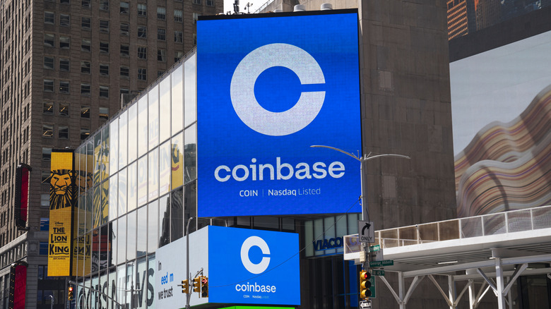 A Coinbase logo on a large screen in Times Square