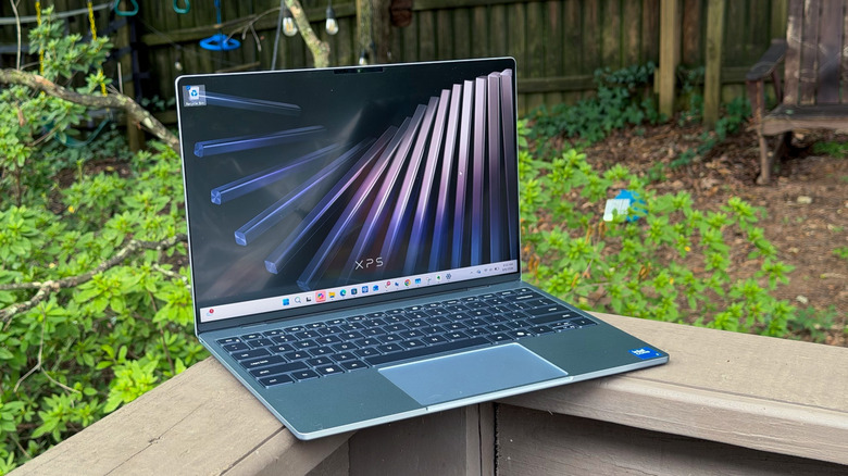 The XPS 13 on a backyard deck.