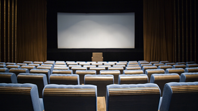 A mockup of a movie theater, showing seats facing a cinema screen.