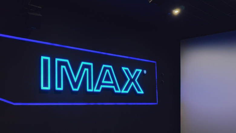 A glowing IMAX movie theater sign.