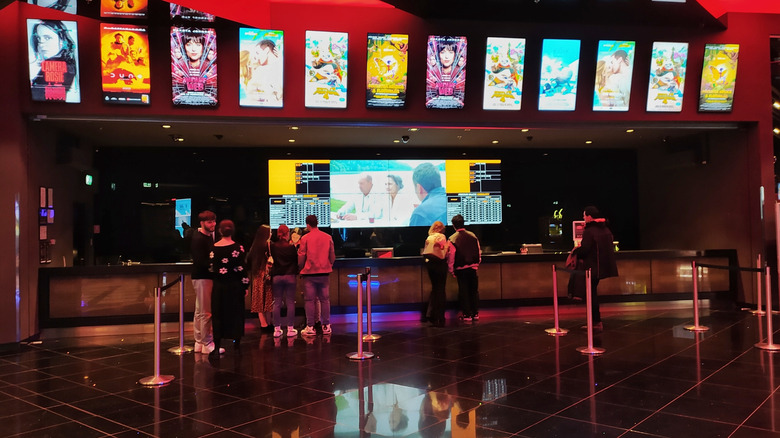 A queue at a box office for a movie theater