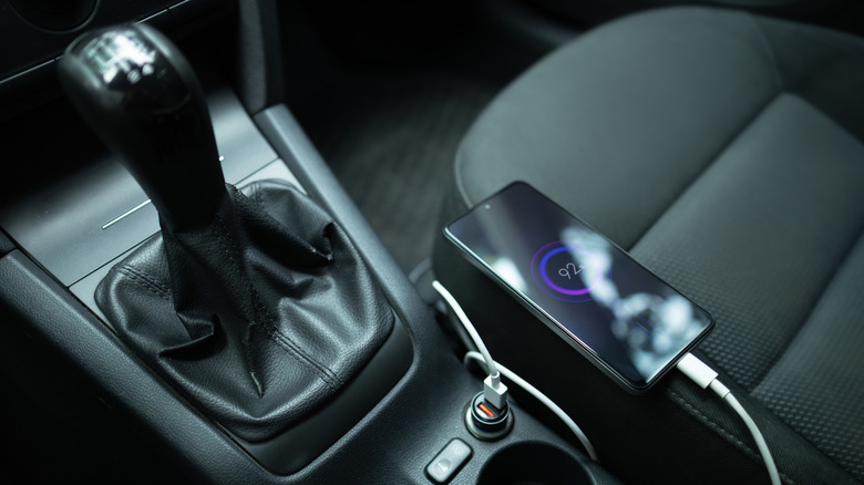 A phone charging in a car