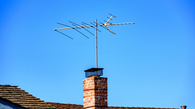 An outdoor directional TV antenna situated on a roof.
