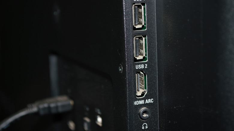 TV side details, with two USB inputs, one HDMI ARC and headphone jack.