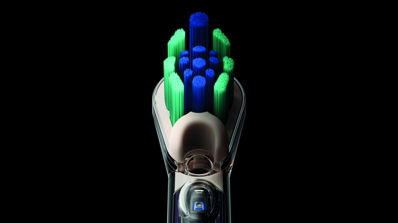 Close up of the head of the CameraJet toothbrush, its bristles and the camera beneath.