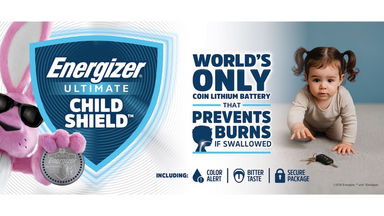Energizer's pink rabbit mascot holds an oversized battery by a blue shield to the left. On the right a toddler with pigtails crawls toward a key fob.