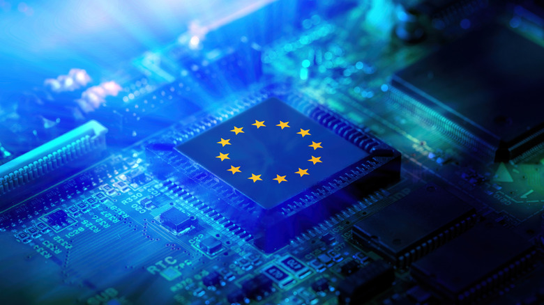 EU flag stars over a computer check with light rays coming out