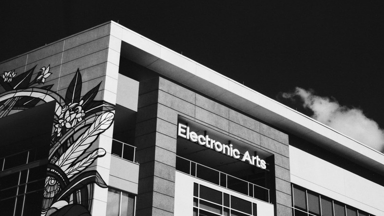 Electronic Arts logo on a building. Another wall feature a floral mural.