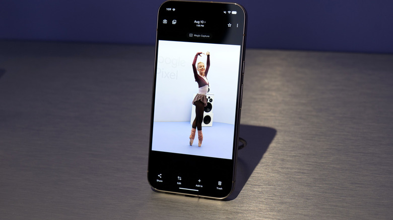 A Google Pixel 11 phone with a photo of a ballet dancer on the display.