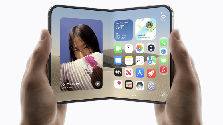 A person holding a foldable iPhone