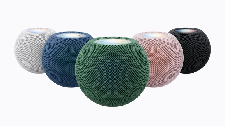 Round smart speakers in pink, blue, green, white and midnight color variants.